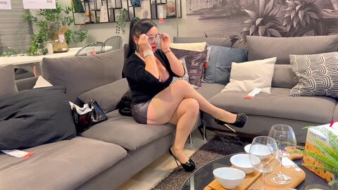 Busty mature cougar Erika Preziosi shows off nylons and stilettos in the furniture store