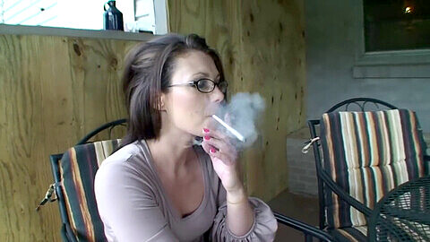Smoking brunette milf with lung cancer indulges in her cigarette fetish while coughing