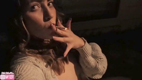 Seductive vixen enjoys a sensual smoke in the evening (FETISH / KINK)