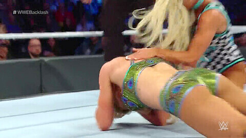 Carmella and Charlotte Flair in a leotard wrestling match