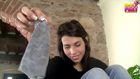 Petite teen wearing socks teases with her milky polished feet