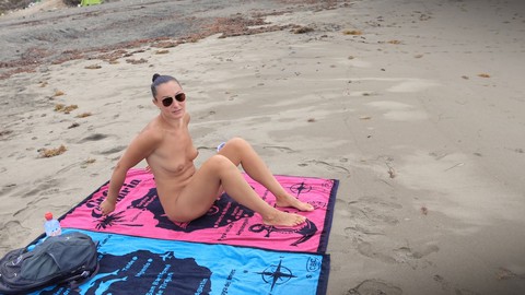 Tasha Sinz strokes a stranger at nude beach