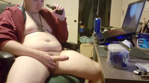 Chubby gay guy enjoys vaping while getting covered in loads of cum