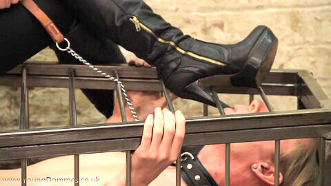 Mistress trampling slave, mistress cage, caged female slaves