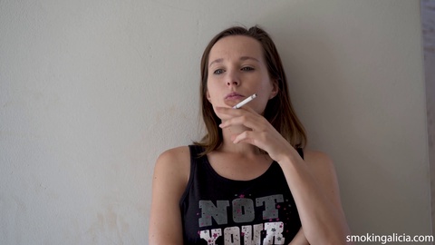 Seductive young woman next door satisfies her smoking fetish cravings
