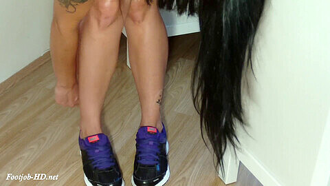 Sneakers, sniffing her sneakers, barefeet in nikes