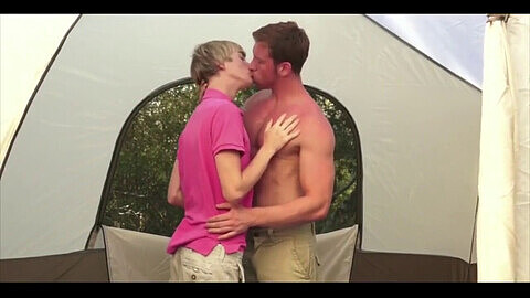 Muscular stud pounds young guy in a tent
