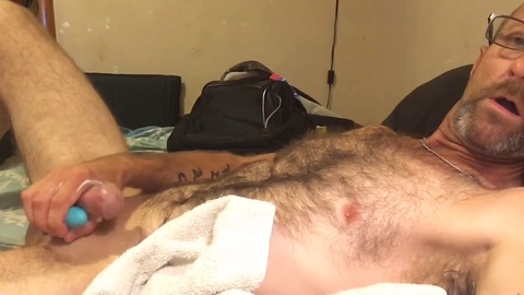 Seductive single country boy milks his massive throbbing cock until it erupts with a massive load of cum, using his favorite toy