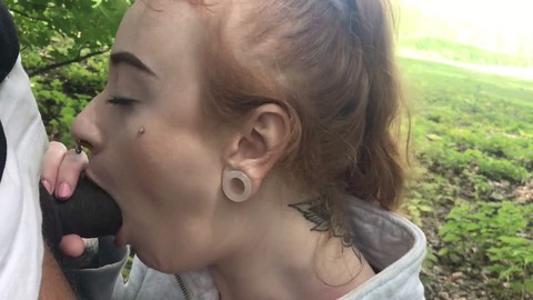 Tattooed teen Azura Alii gives a sloppy outdoor blowjob to a well-endowed black man Darrell Deeps, culminating in a facial cumshot