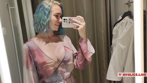 Trying on sheer outfits in the mall dressing room for a seductive show