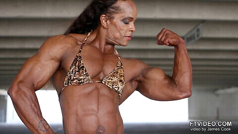 Nancy L flexes her impressive muscles, showing off her bodybuilder physique!