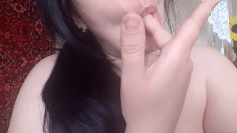 Sensual babe seductively sucking on fingers daydreaming about a massive dick in her mouth