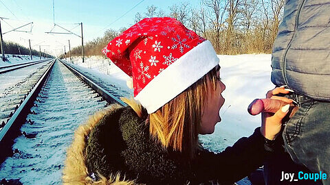 Naughty couple enjoys a first-time outdoor railway blowjob in the winter