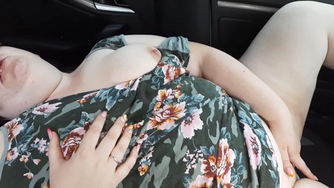 Horny curvy lady pleasures her massive hairy pussy in the car near a busy highway