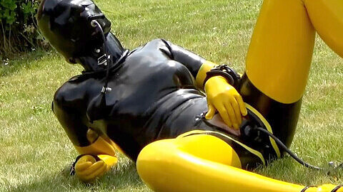Horny guy in spandex catsuit pleasures himself with inflatable dildo